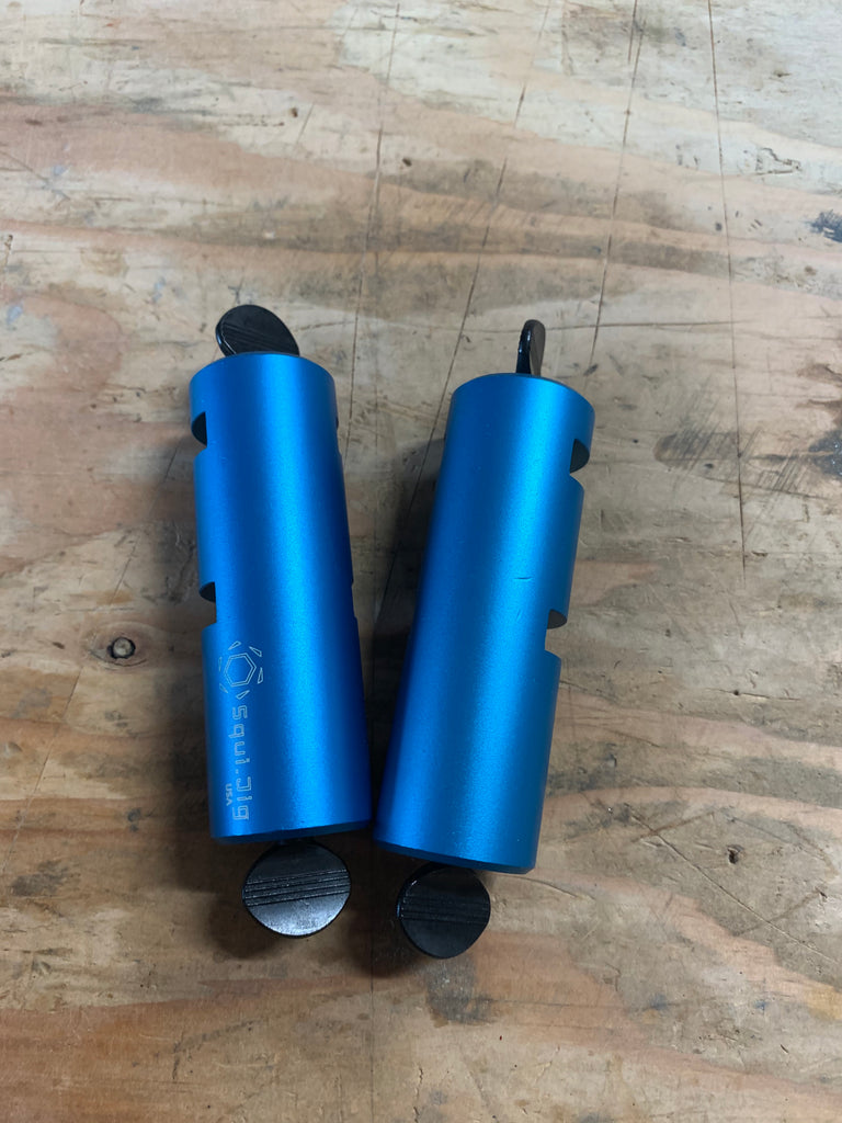 Blue Squijig Framing jig set, laying side by side, with one small dent in the jig on the right.